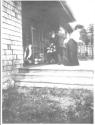 Guests on porch, Oak Lodge trip