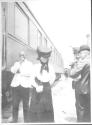Companions near passenger rail car, Oak Lodge Trip