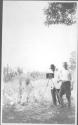 George Eastman assisting man with camera, Oak Lodge Trip