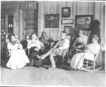 George Eastman and guests in living room, Oak Lodge Trip