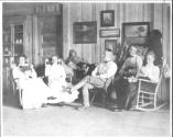 George Eastman and guests in Living Room, Oak Lodge Trip