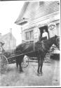 Horse drawn carriage in front of store, Oak Lodge Trip