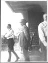 George Eastman, unidentified man and Walter Hubbell on porch, Oak Lodge Trip