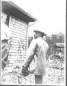 George Eastman talking with unidentified man, Oak Lodge Trip