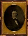 [Reproduction of a painting of a man wearing a suit]