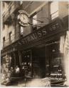 [S. Strauss wineshop with sign and clock]