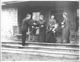 George Eastman and guests on porch, Oak Lodge Trip