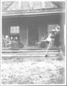 George Eastman photographing guests on porch, Oak Lodge Trip
