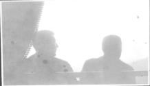 Two seated men from behind, Oak Lodge Trip