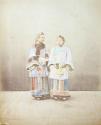 [Two standing women]