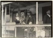 [Italian family on ferry boat, leaving Ellis Island]