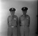 [Two men in military uniforms]