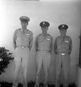 [Three men in military uniforms]