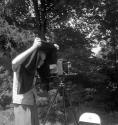 [Beaumont Newhall behind a camera]