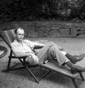 [Beaumont Newhall on an outdoor chair]