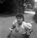 [Woman with pencil and paper in her hands]