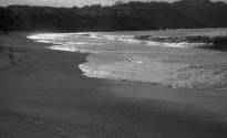 [Waves breaking on beach]