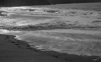 [Waves breaking on beach]