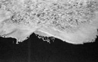 [Froth of wave on beach]