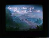 Casting a silver light over field and forest.