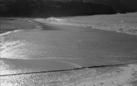 [Waves breaking on beach]