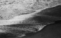 [Froth of wave on beach]