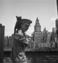 [Beaumont Newhall with black cat in New York City]