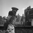 [Beaumont Newhall with black cat in New York City]
