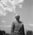[Charles Sheeler standing on roof in New York City]