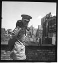 [Beaumont Newhall with black cat in New York City]