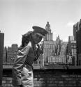[Beaumont Newhall with black cat in New York City]