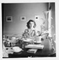 [Nancy Newhall seated across table]
