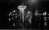 [People out on rainy evening in Paris]
