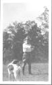 George Eastman with rifle and dog, Oak Lodge Trip