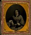 [Seated woman with dress and shawl]