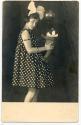 [Woman with teddy bear and balloon]