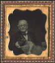[Elderly man with large dog]