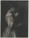 [Woman holding plate]