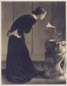 [Woman with lily]