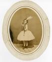 [Girl dancer in military-inspired or band uniform]