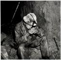 Lester smoking after drilling in a bypass drift, Kerr Mine, Virginiatown, Ontario, Canada