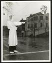 Women In Essential Services. Member of the Oakland, Calif. Women's Safety Traffic Reserve, Mrs. E.K. Sabel helps relieve the shortage of traffic policeman by guarding school zones.