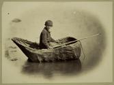 Boy and coracle