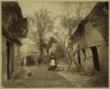 [Woman by a barn]