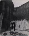 [Laundry of the Swiss Guards hanging behind the Bernini columns flanking St. Peter's]