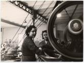 [Two women working on aircraft assembly]
