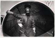 [Israel, welder posed by large cylinder]