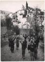 View of Cocullo with boys carrying snakes preceding the procession