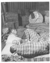 [Family of 4 sleeping on the floor of warehouse in Salonika]