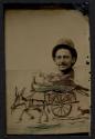 [Caricature of man riding in donkey cart]